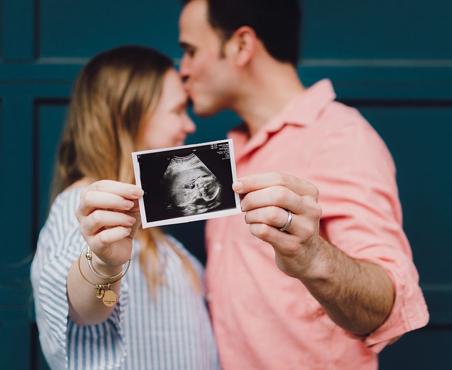 Parents holding ultrasound photo